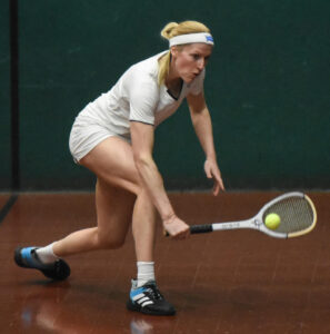 Claire Fahey hitting a backhand on Oratory court